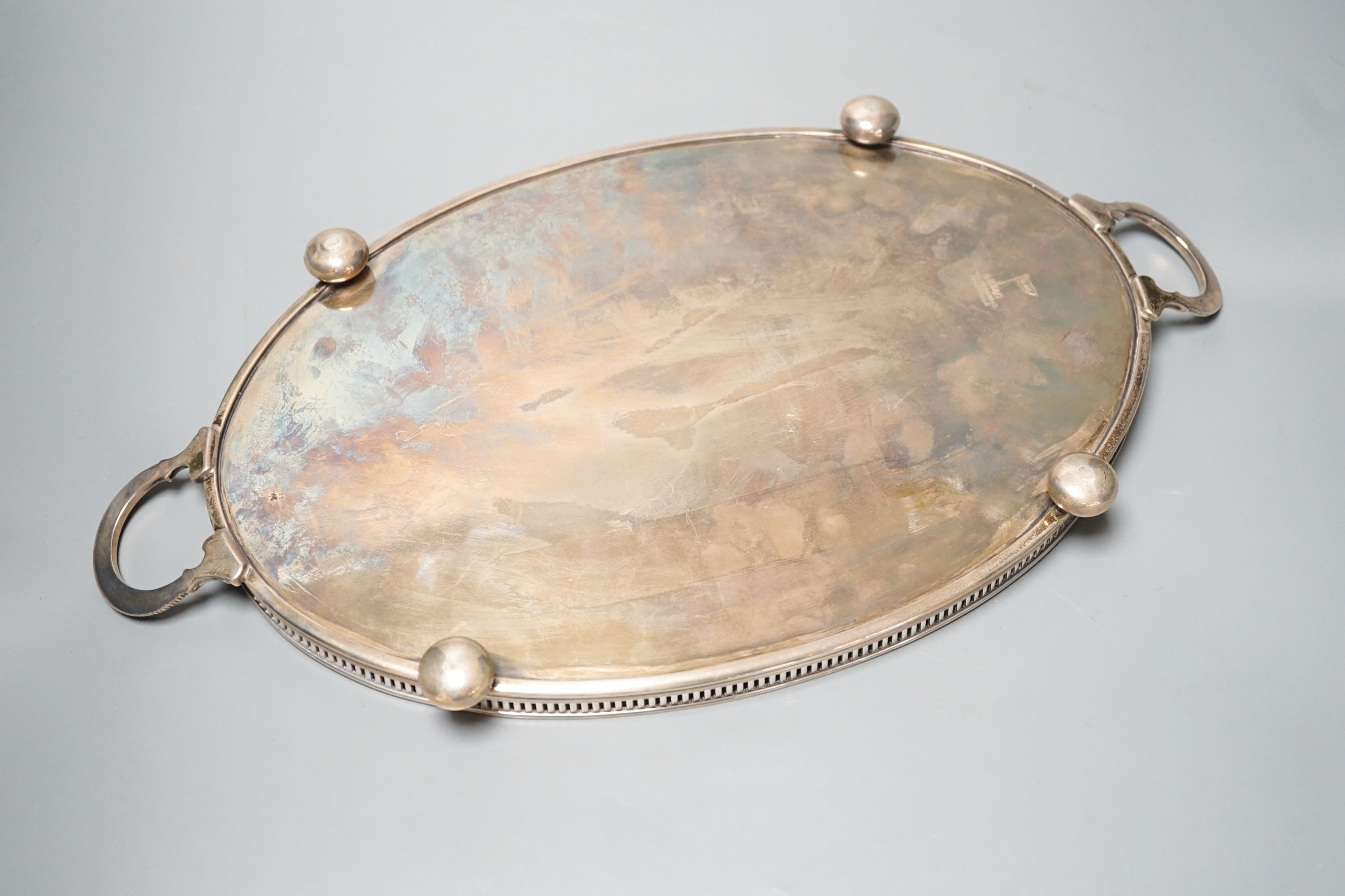 A late Victorian silver oval two handled tea tray, by Walker & Hall, Sheffield, 1898, 45.2cm over handles, 38.5oz.